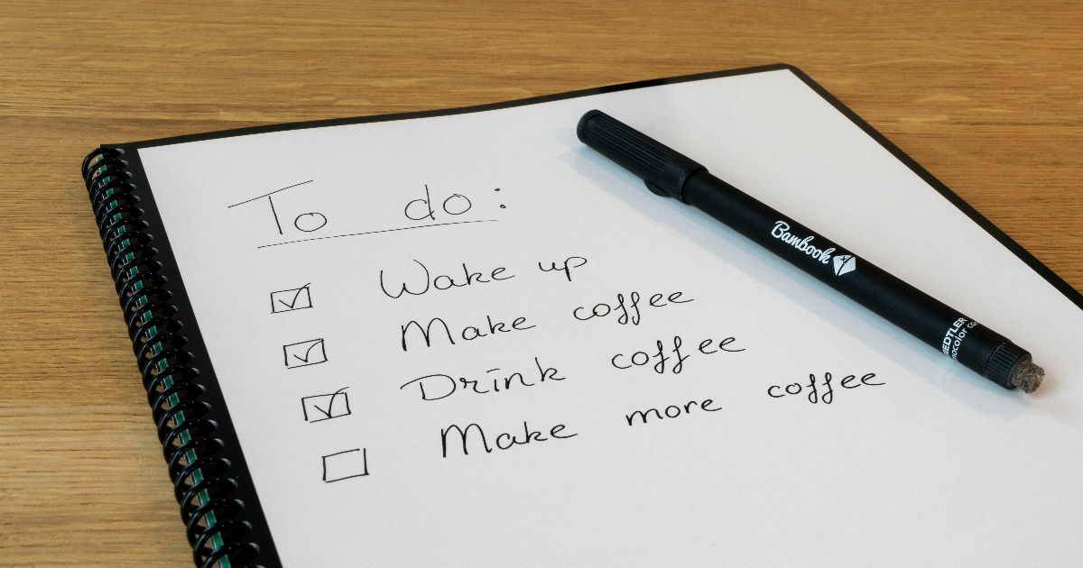 An open notebook on a page with a bucket list